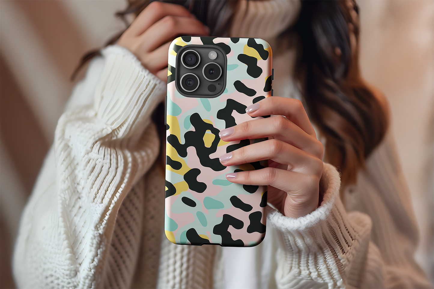 A cute girl holding our 80s Camo Cool design phone case