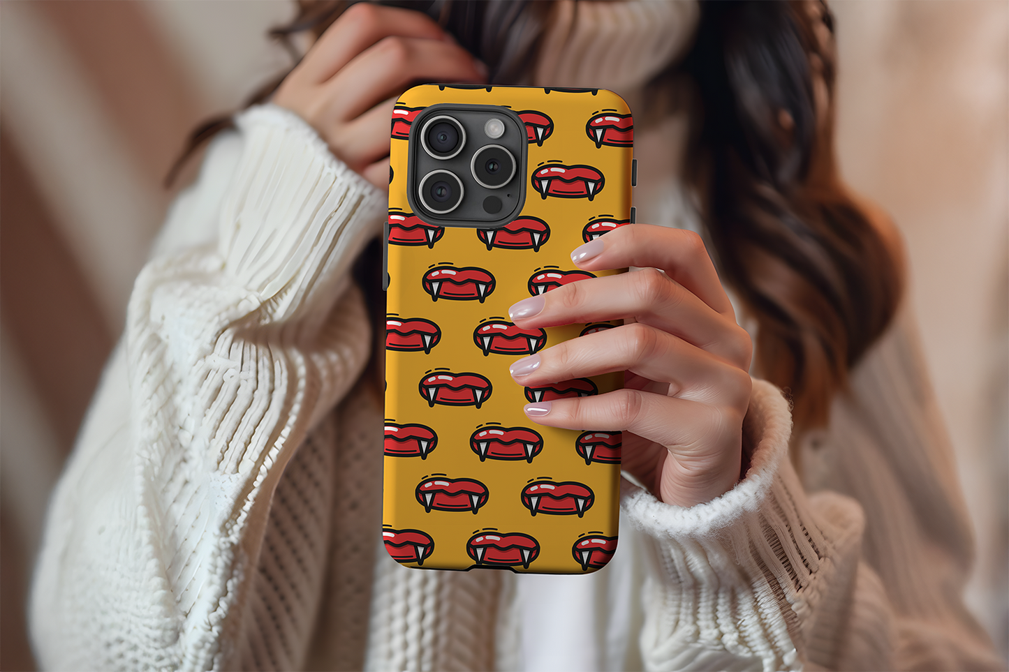 A cute girl holding our Bite Me design phone case