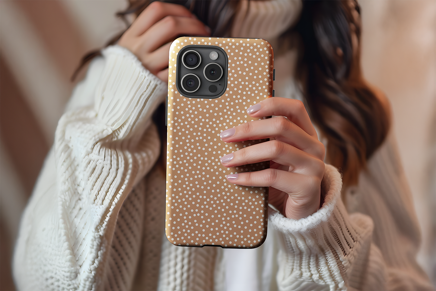 A cute girl holding our Caramel Dot design phone case