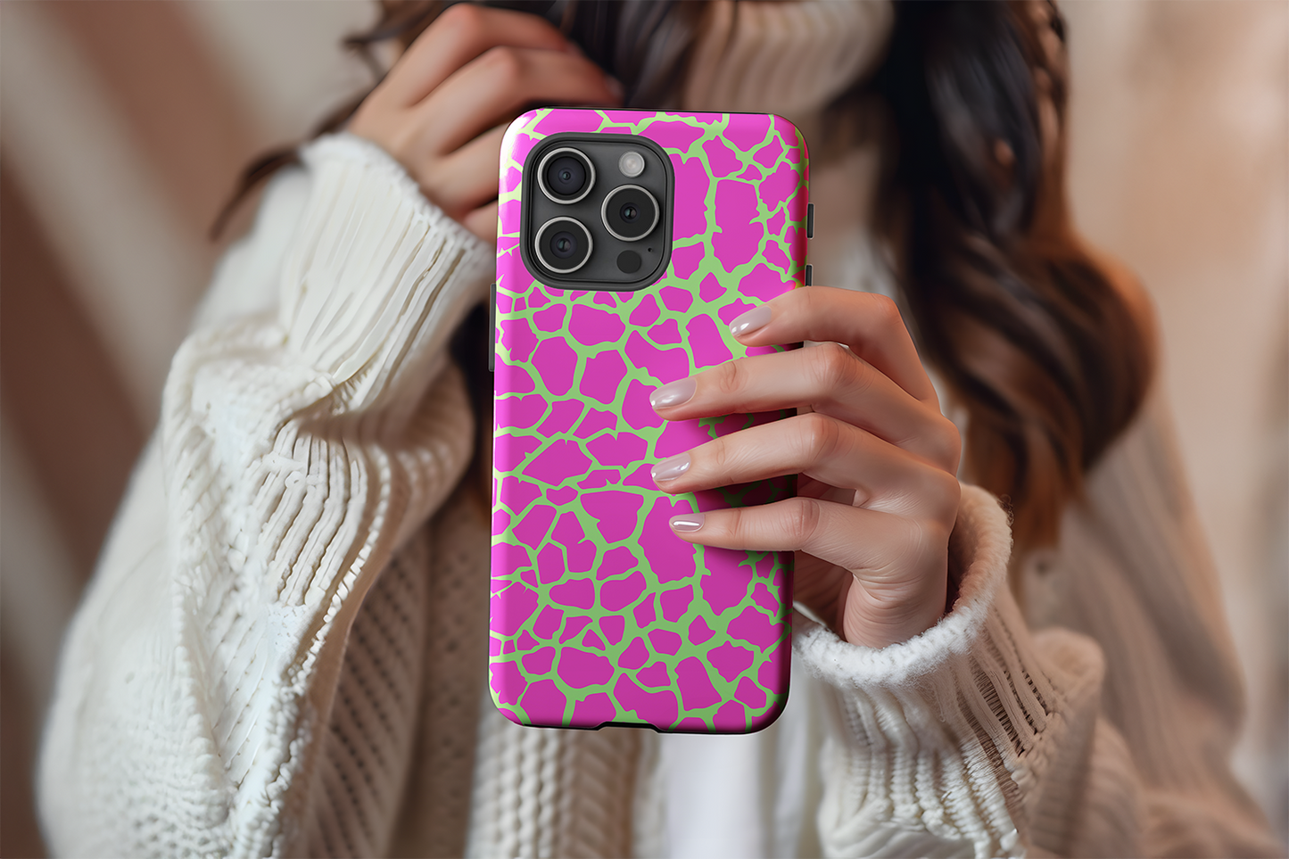 A cute girl holding our Crackle Punk design phone case