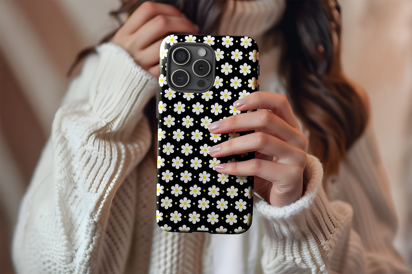 A cute girl holding our Ditsy Daisy design phone case