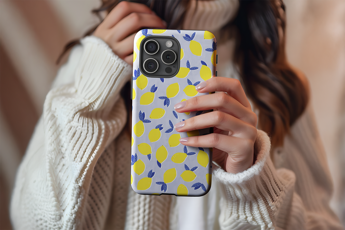 A cute girl holding our Lemon Drop design phone case