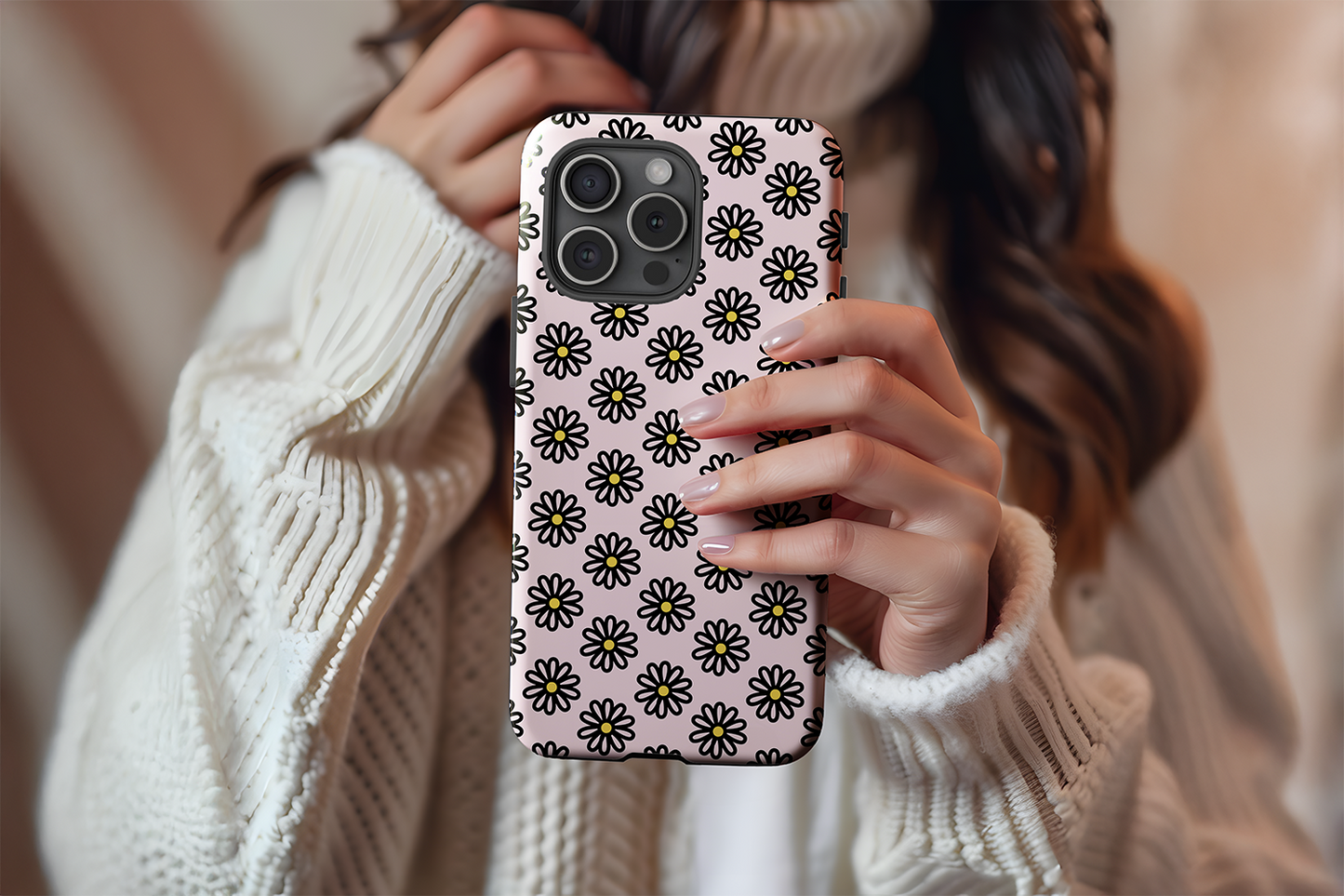 A cute girl holding our Oopsie Daisy design phone case