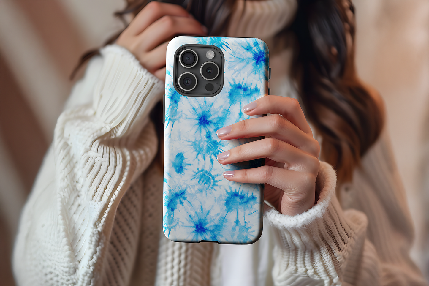 A cute girl holding our Tie Dye Blue design phone case