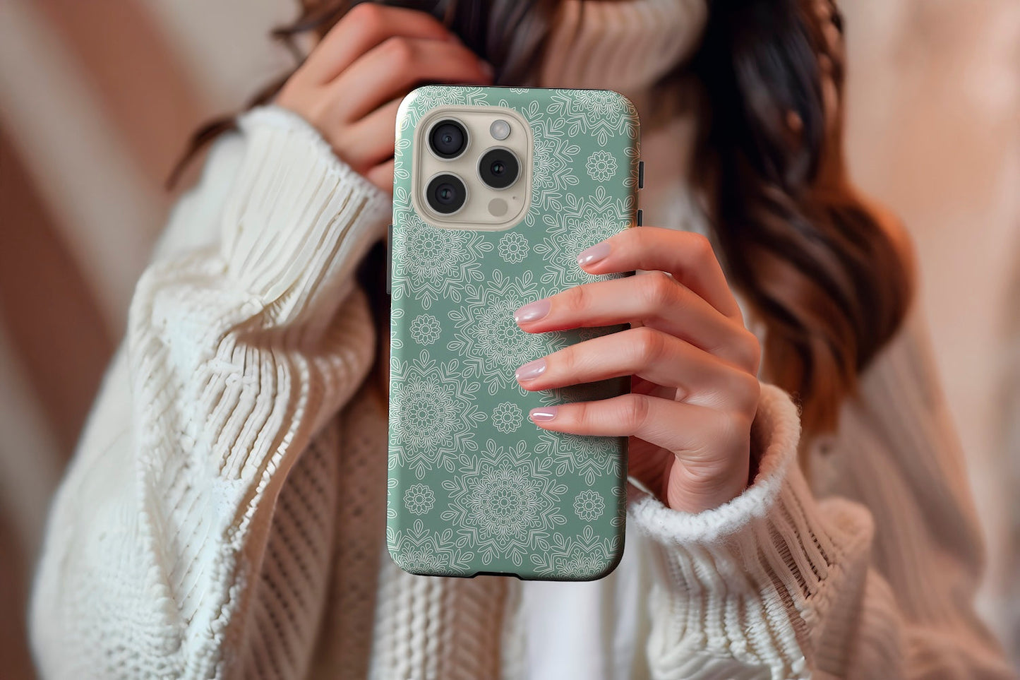 A cute girl holding our Green Mandala design phone case