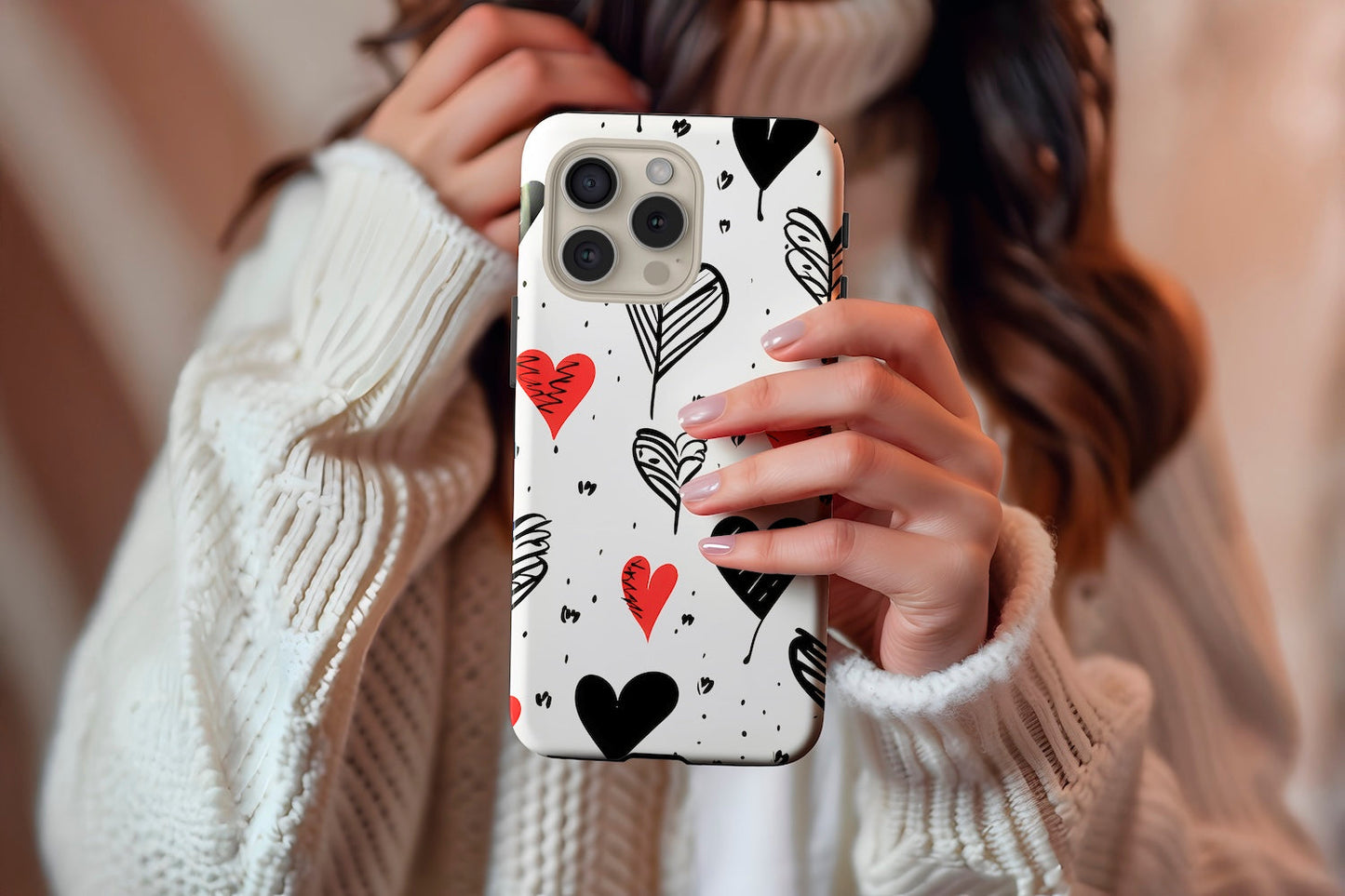A cute girl holding our Vintage Hearts design phone case