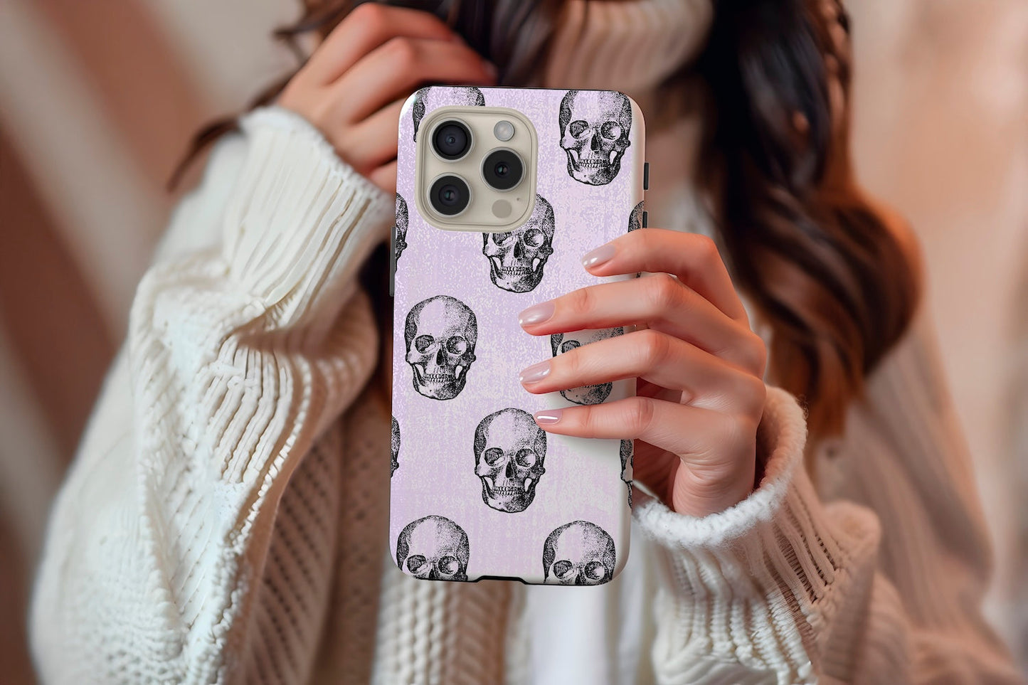 A cute girl holding our Watercolour Skull design phone case