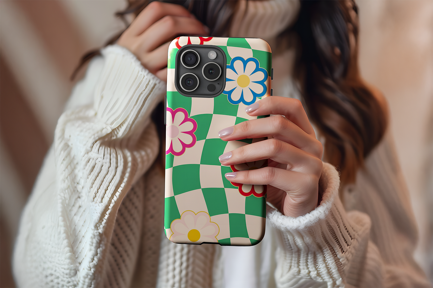 A cute girl holding our Grandmas House design phone case