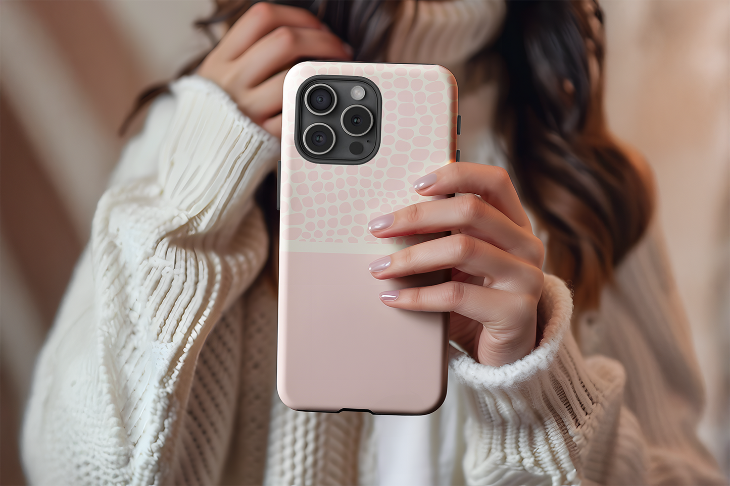A cute girl holding our Pink Pebble design phone case