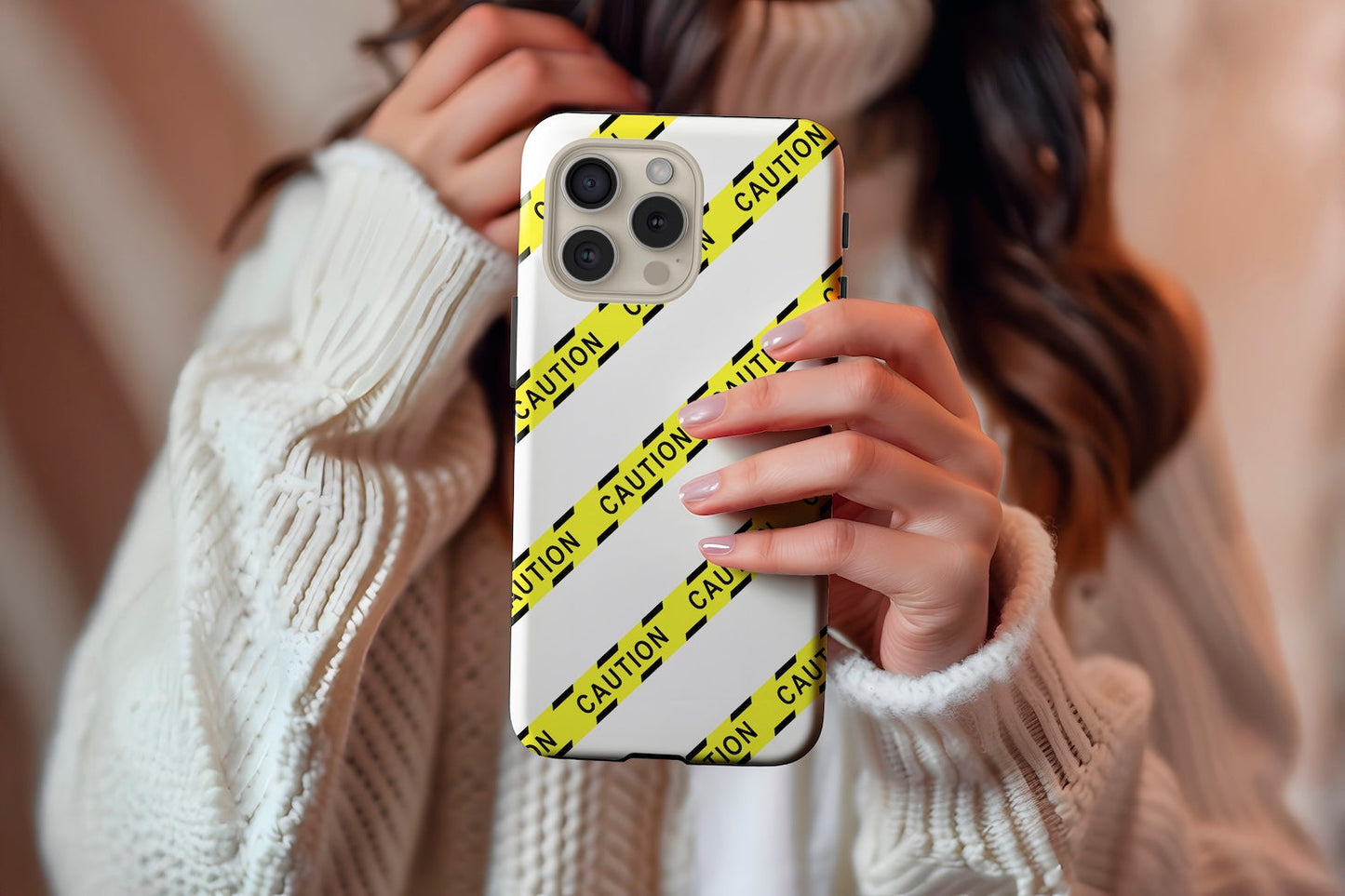 A cute girl holding our Caution design phone case